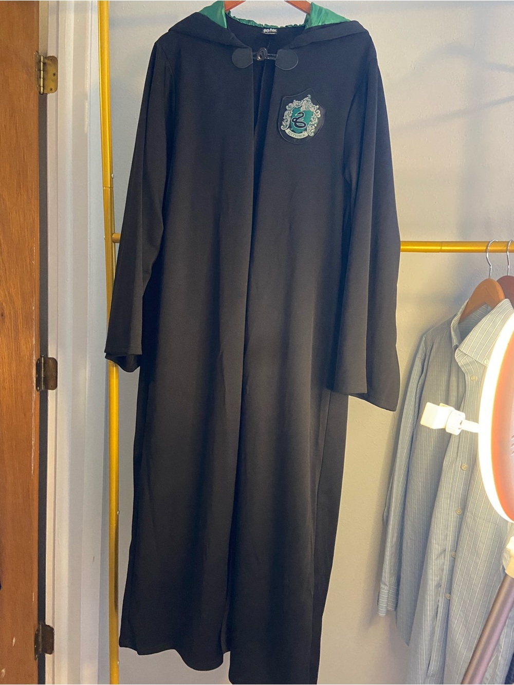 Black Hooded Cape with Green Lining and Crest Accent